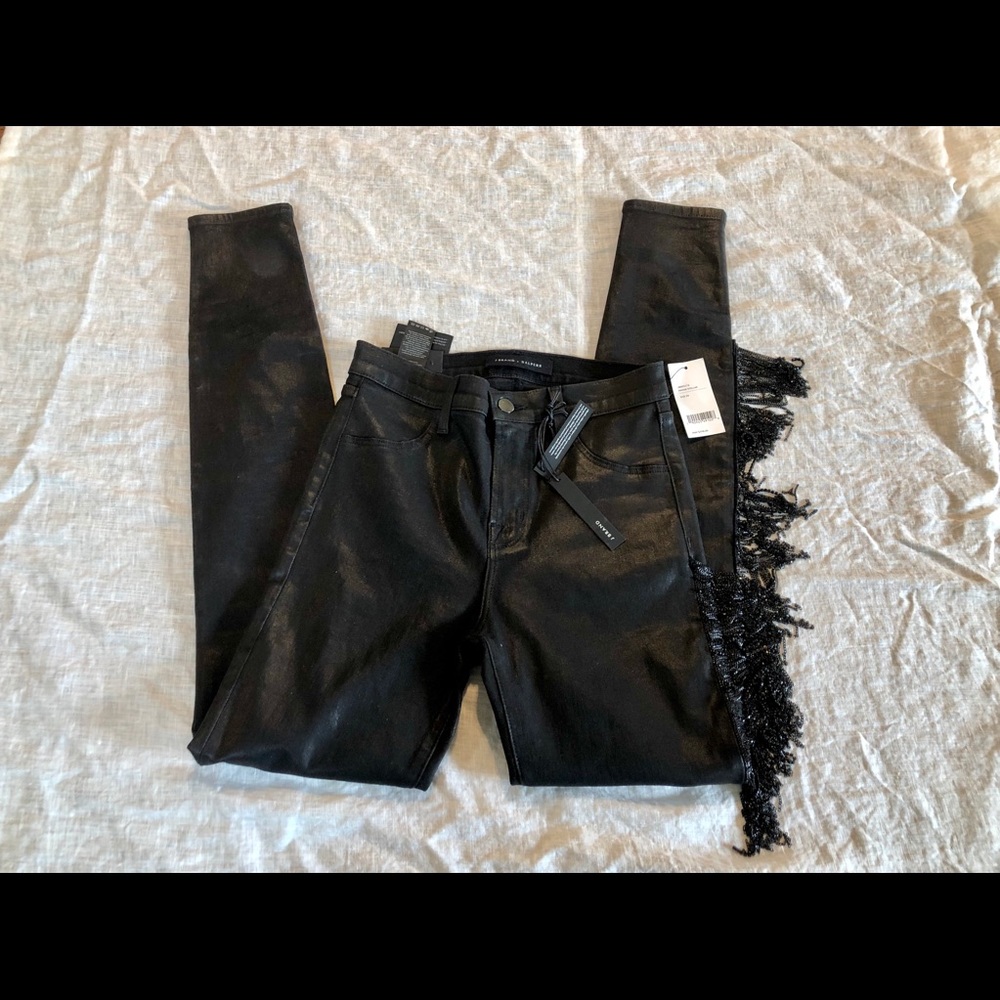 Black coated skinny jeans with fringe